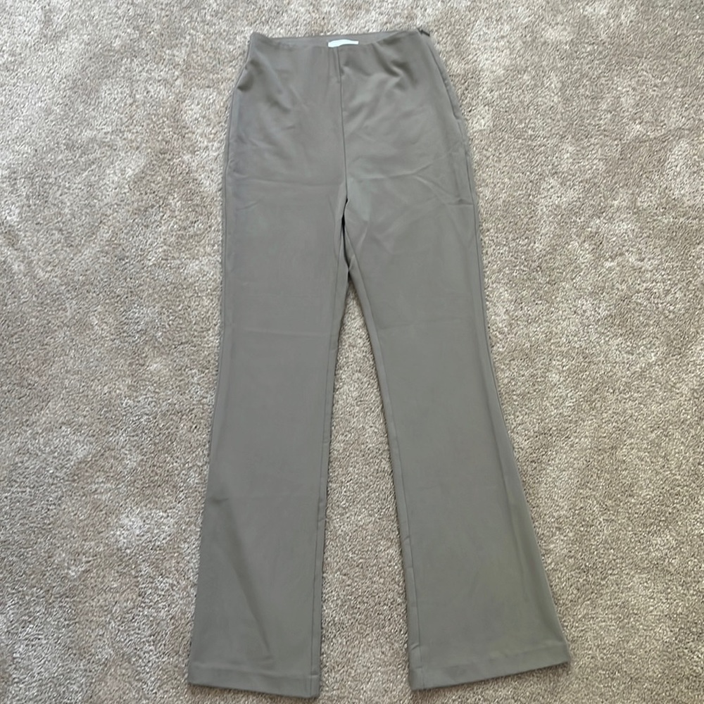 More of a Taupe brown! Great condition and extremely flattering
